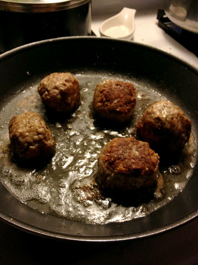 meatballs frying in the pan