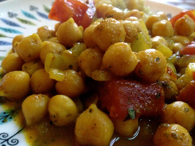 Curried chickpeas served alongside brown rice