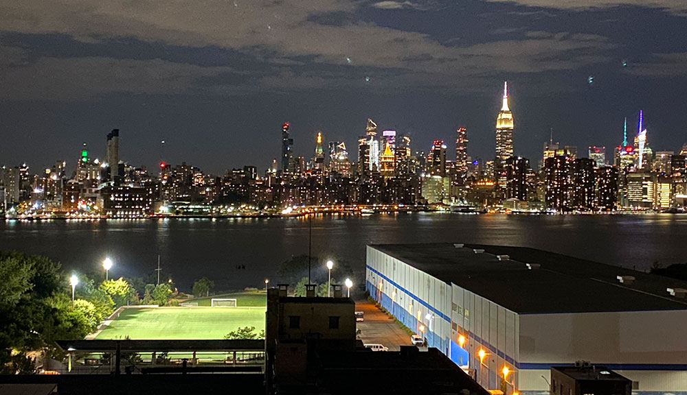 The East River and Manhattan skyline from the roof of Laser Wolf. From the Left: 14th street generating station, Madison Square Park Tower, One Madison Park, Metropolitan Life Tower, Hudson Yards, Empire State Building 4 Times Square, Bank of America Tower