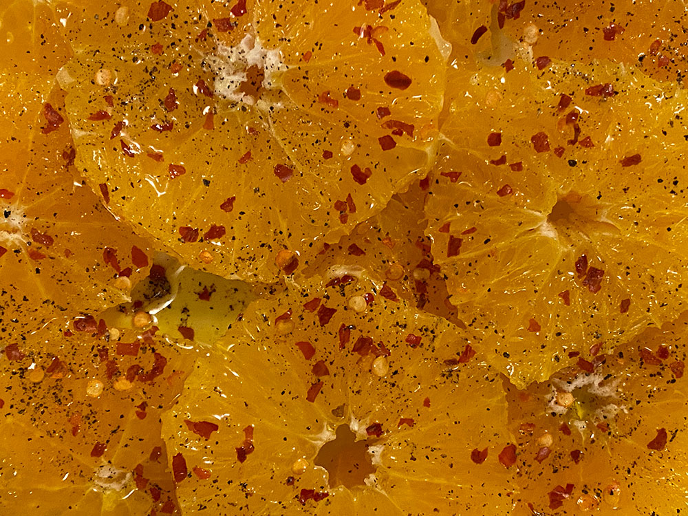 orange slices with olive oil and pepper