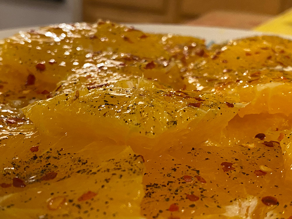 orange slices with olive oil and pepper