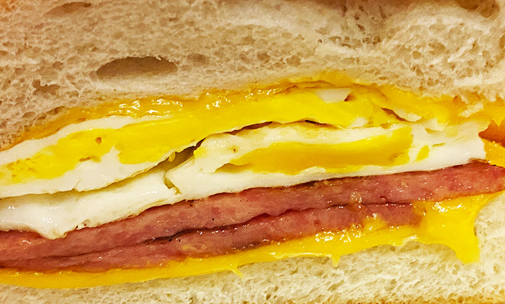 cross section of the taylor ham egg and cheese sandwich  from a diner