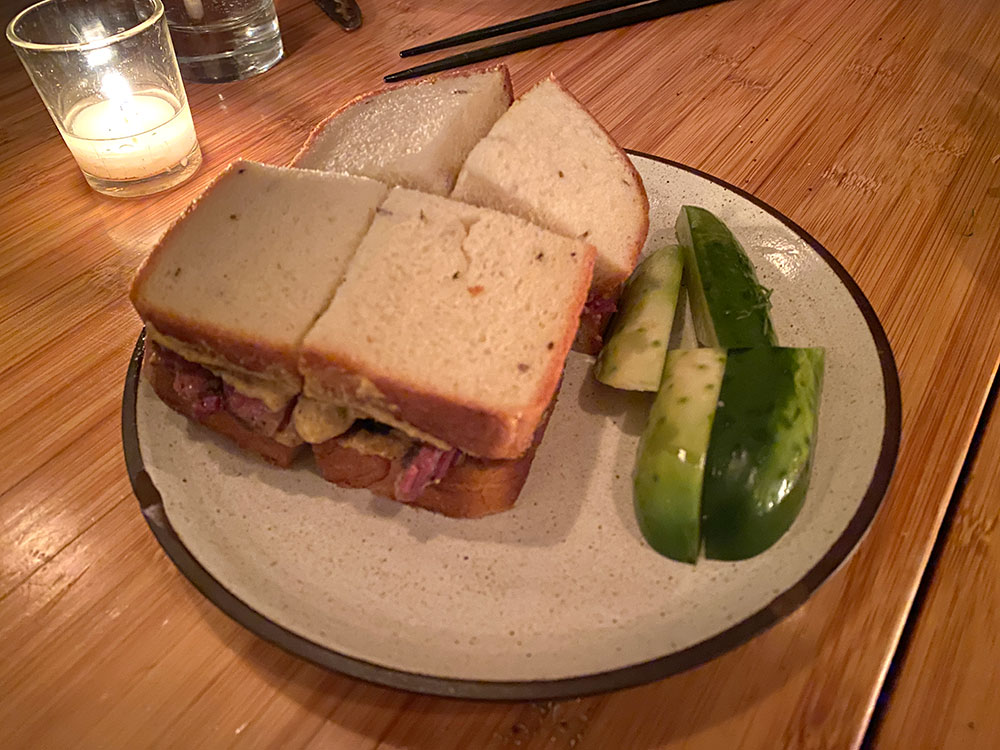 Pastrami sandwich with pickles at Shalom Japan