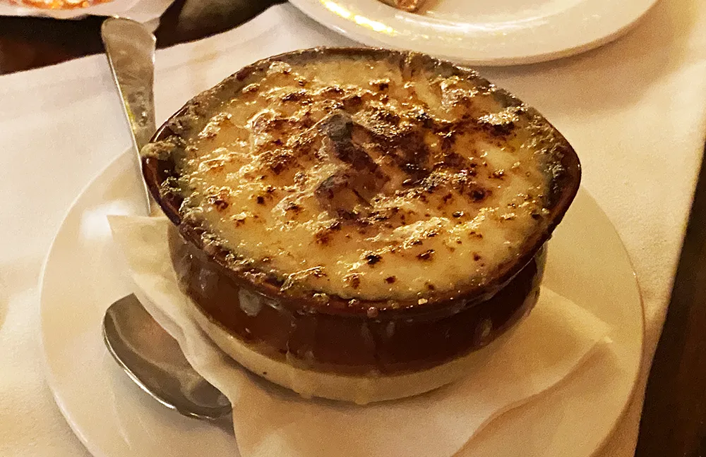 A French onion soup topped with melted cheese