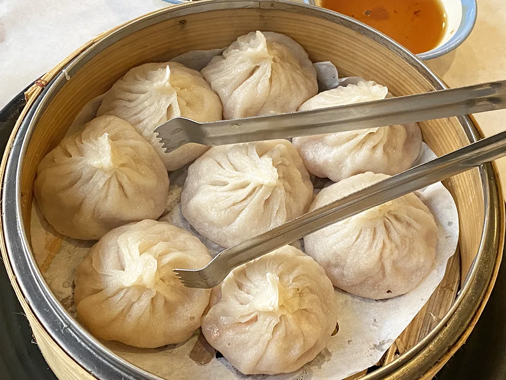 Soup dumplings in a bamboo basket